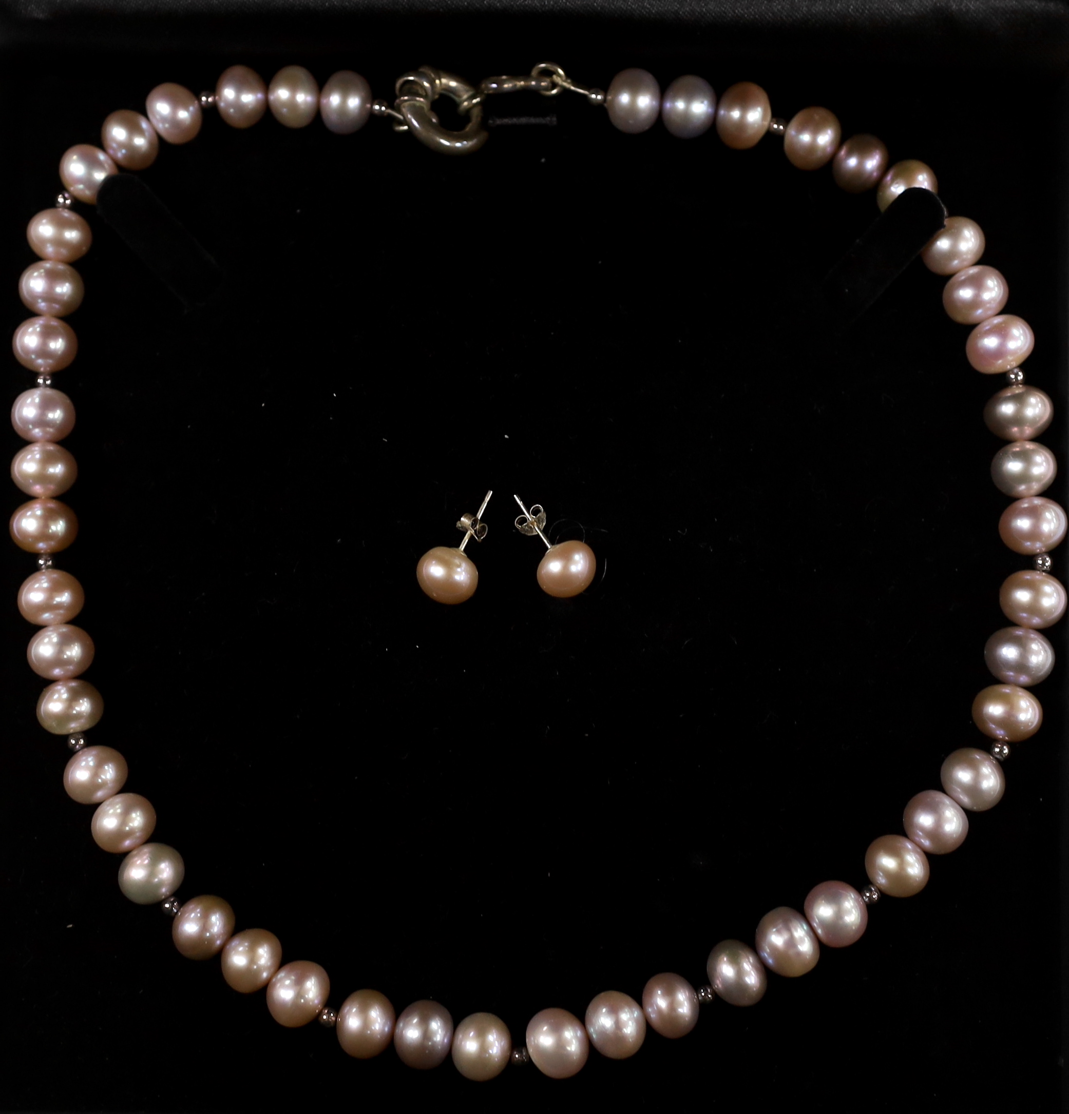 A single strand South Sea cultured pearl necklace, with sterling clasp, 48cm, in Pruden & Smith box and a pair of similar ear studs.